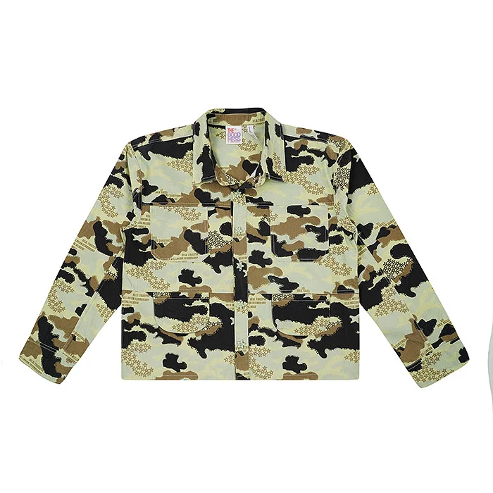 Green and khaki camouflage kids' shirt jacket with chest pockets laid flat on a white background under soft even studio lighting, a product-only image that pairs with on-model kidswear photos