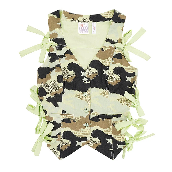 Top-down flat lay of a kids camouflage print waistcoat with pastel green fabric ties on a pure white background, sharp print detail and symmetrical styling for an ecommerce catalogue reshoot