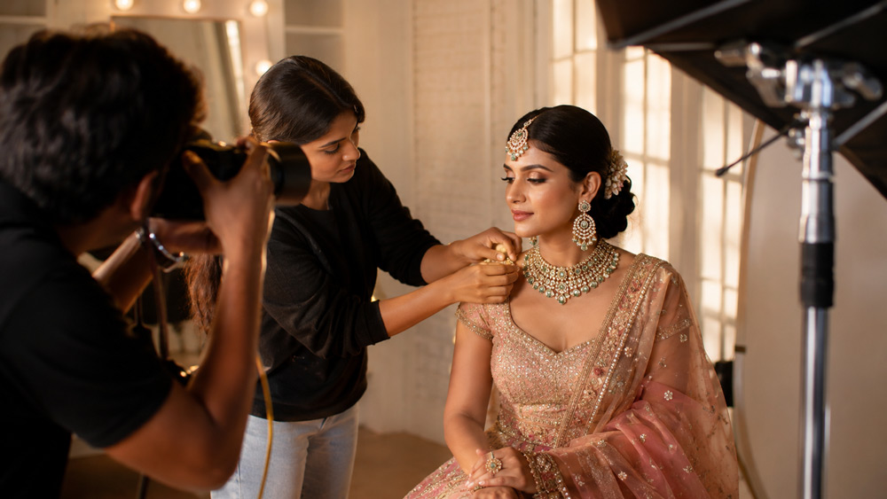 Editorial fashion photography of an Indian bridal jewellery model wearing full polki bridal set with maang tikka in soft warm golden hour lighting for luxury jewellery brand catalogue Delhi NCR