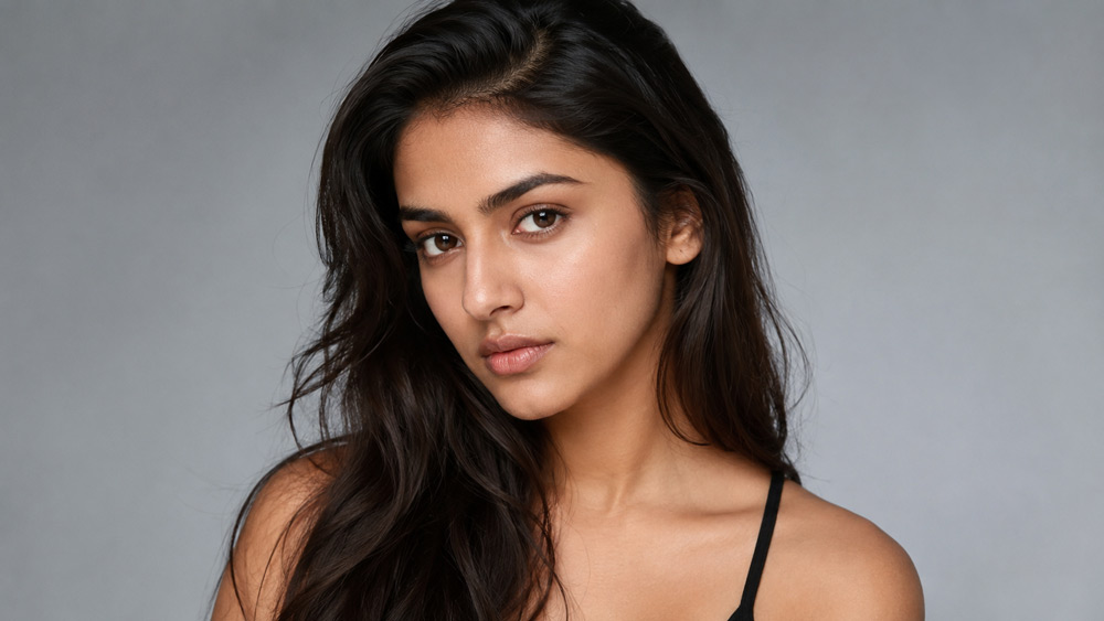 Professional female model beauty headshot with natural studio lighting on soft grey backdrop shot by model photographer in Delhi NCR