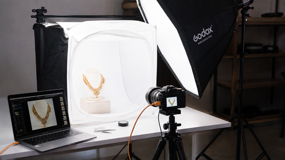 Jewellery photoshoot near me setup at a professional Delhi NCR studio with a diamond ring on black acrylic and a controlled soft-lit macro composition