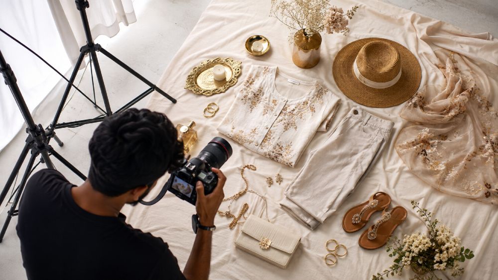 Behind the scenes professional flat lay photography studio Delhi NCR overhead camera rig softbox lighting garment styling setup for clothing brand catalogue