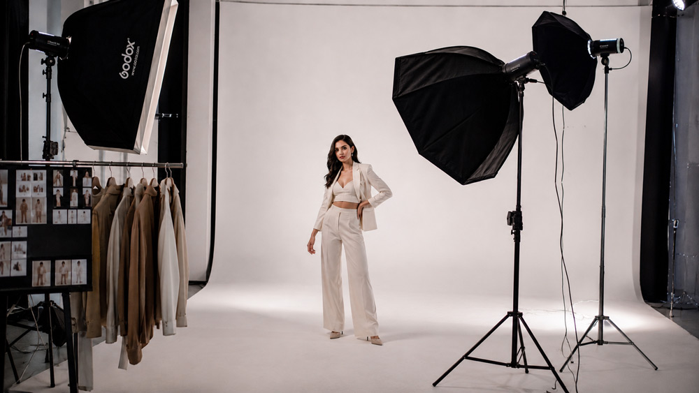Editorial fashion model photoshoot on cyclorama with soft strobe lighting, campaign-style styled outfit, professional fashion campaign photography for D2C clothing brand in Delhi studio