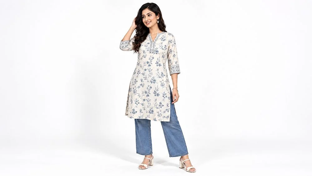 Amazon product image requirements example: an Indian woman model in a white floral printed kurta with blue straight pants standing full length on a seamless pure white studio background, evenly lit with soft shadows for an Amazon clothing main image