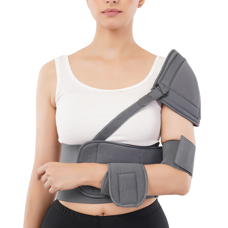 Grey shoulder, arm and wrist support brace worn by a model